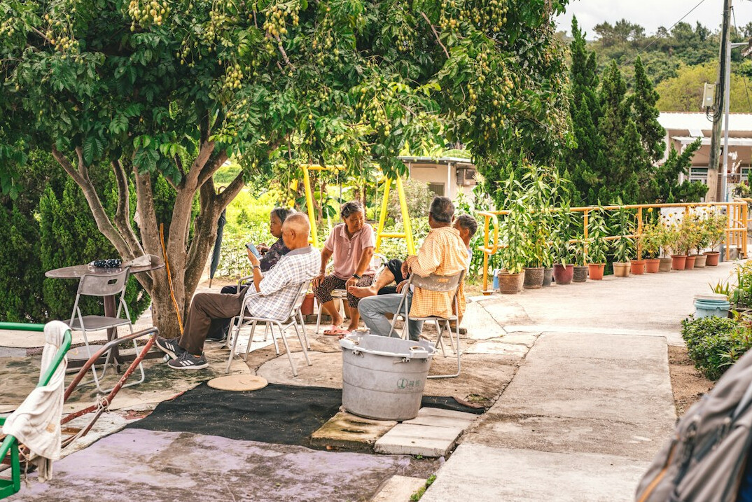 Group of adults in a focus group discussion around a table