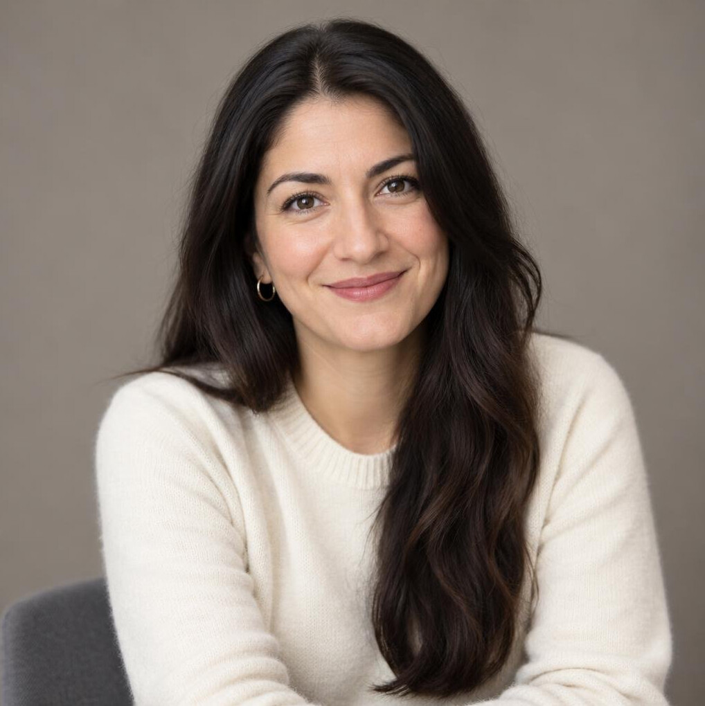 Studio portrait of a young woman with dark hair, media researcher